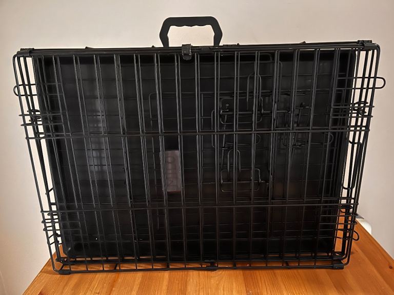 Double door foldable pet crate with tray and mat. 