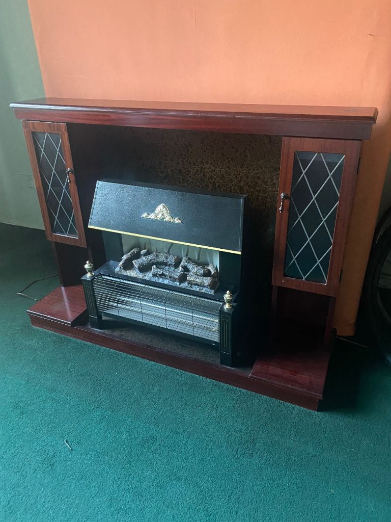 Electric fire with fire place, dark wood
