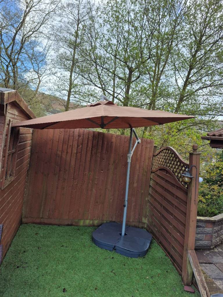 3 meter Brown cantilever parasol with shade, base and weights, in good used condition
