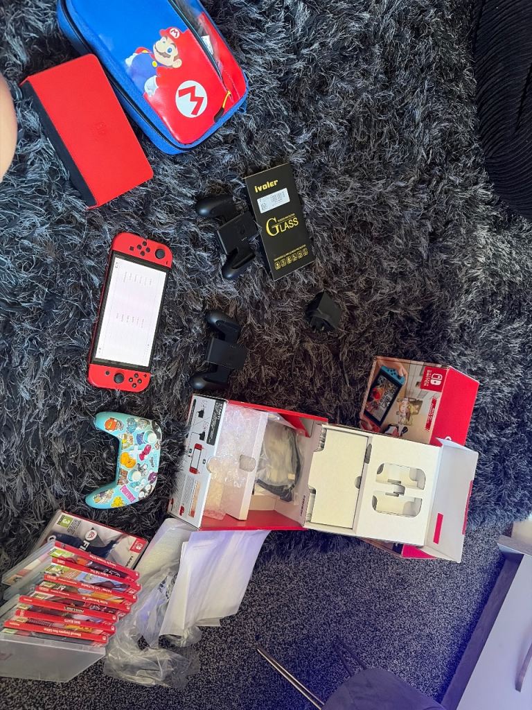 Nintendo Switch Console with Games and Accessories – Good Condition