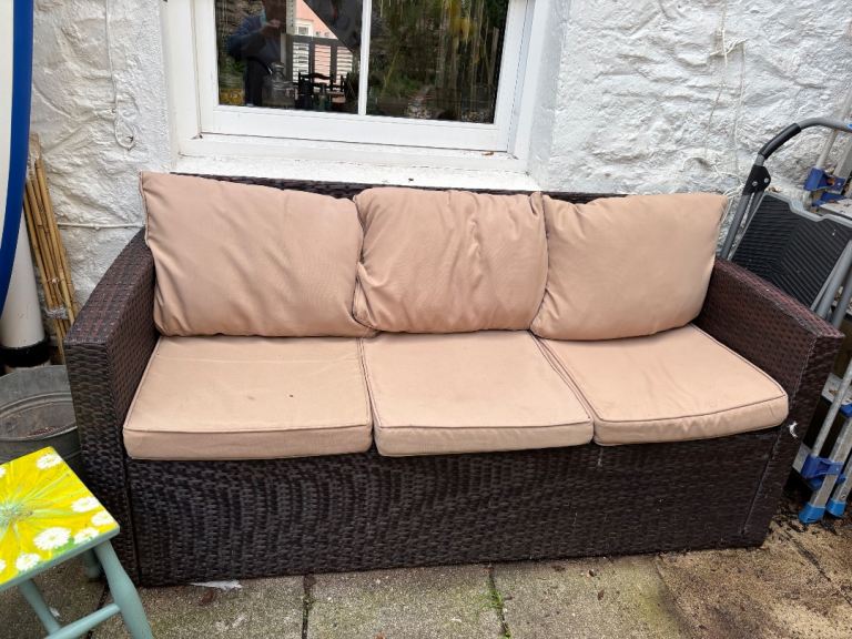 Brown Wicker Outdoor Sofa with Beige Cushions – Good Condition