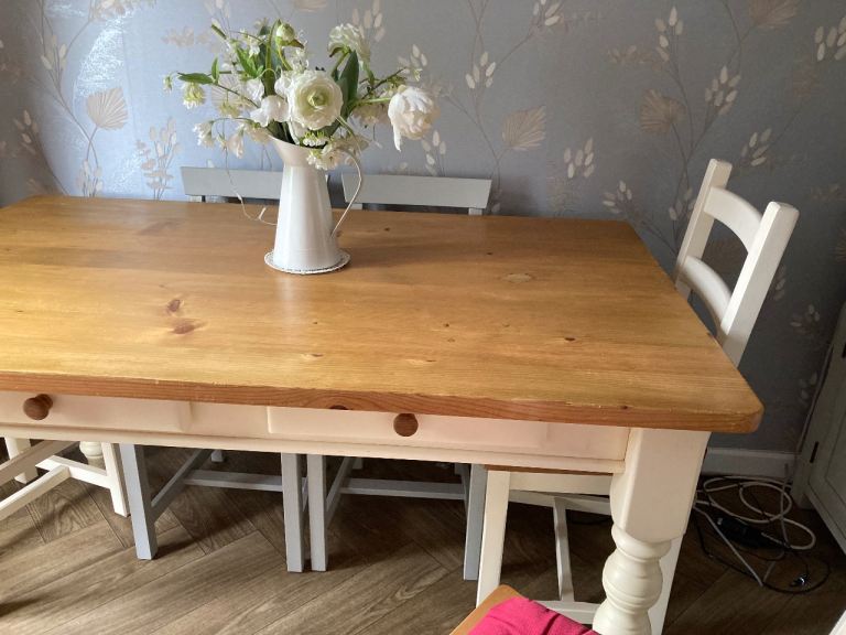  solid table with drawers and four chairs , cream legs /base -edging  