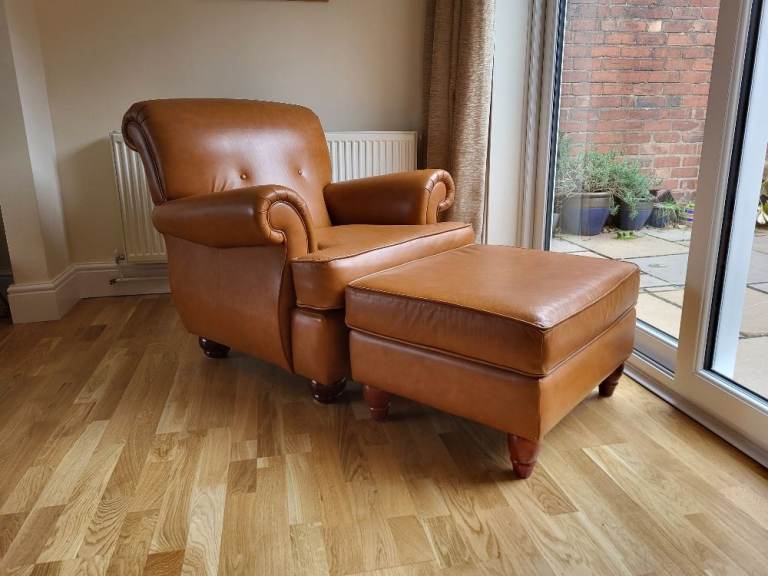 Tan leather armchair and matching leather footstool