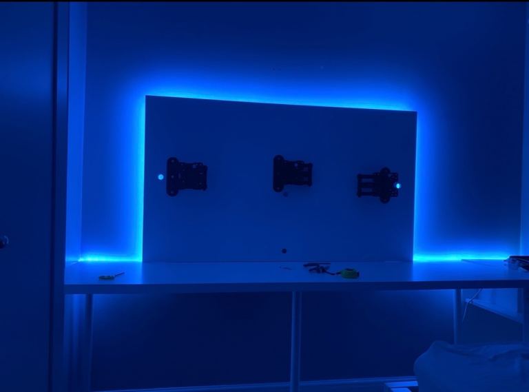 image for Backlit, wall mounted desk. With 3x wall mount floating monitor arms