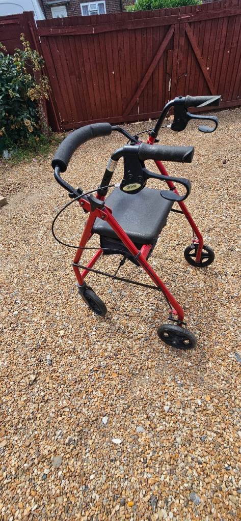 Red Mobility Walker with Seat and Brakes, Good Condition