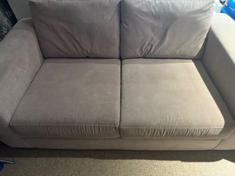 2 seater sofa in pale purple colour 