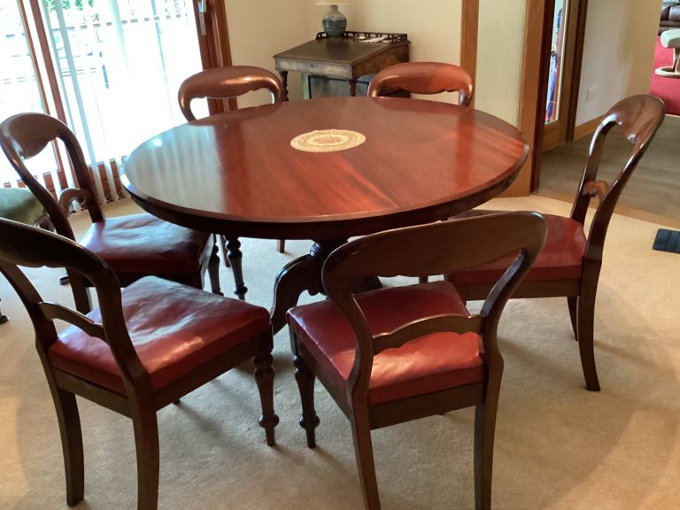 Antique mahogany dining table and chairs 