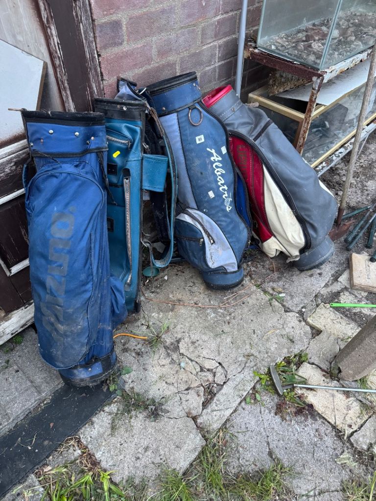 Vintage golf clubs and caddy’s 