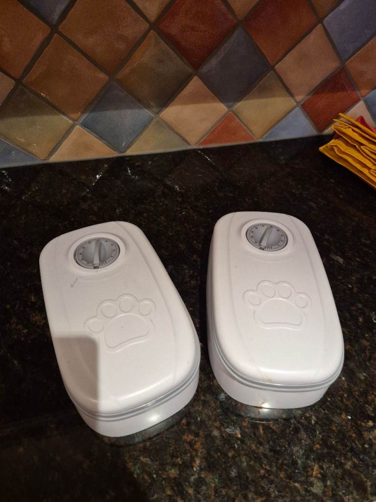 2 automatic  pet food containers perfect condition