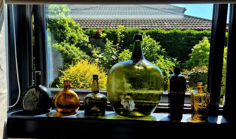 Collection of Decorative Glass Bottles – Various Shapes & Colours