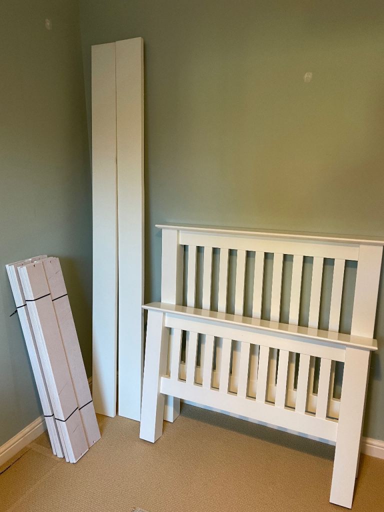 White wooden single bed