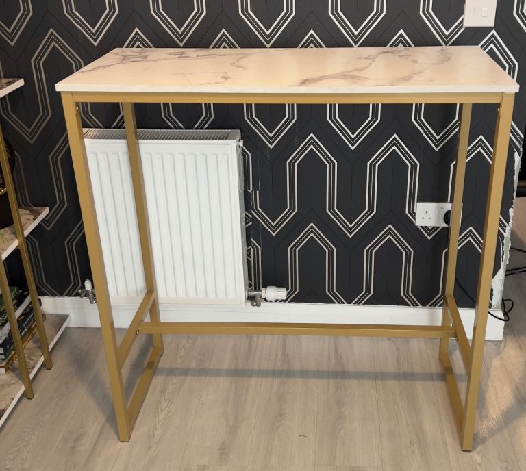 Marble breakfast bar with grey velvet stools 