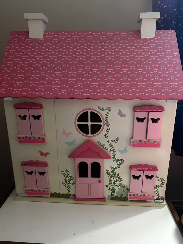 Wooden dolls house with furniture 