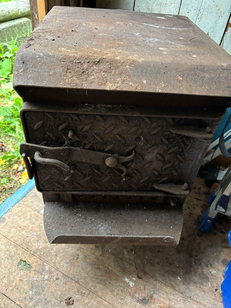 Old Markland log burning stove. Only suitable for outdoor use. 