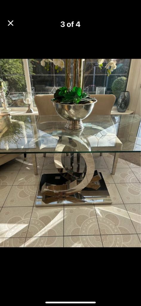 Glass dining room table with silver CC base