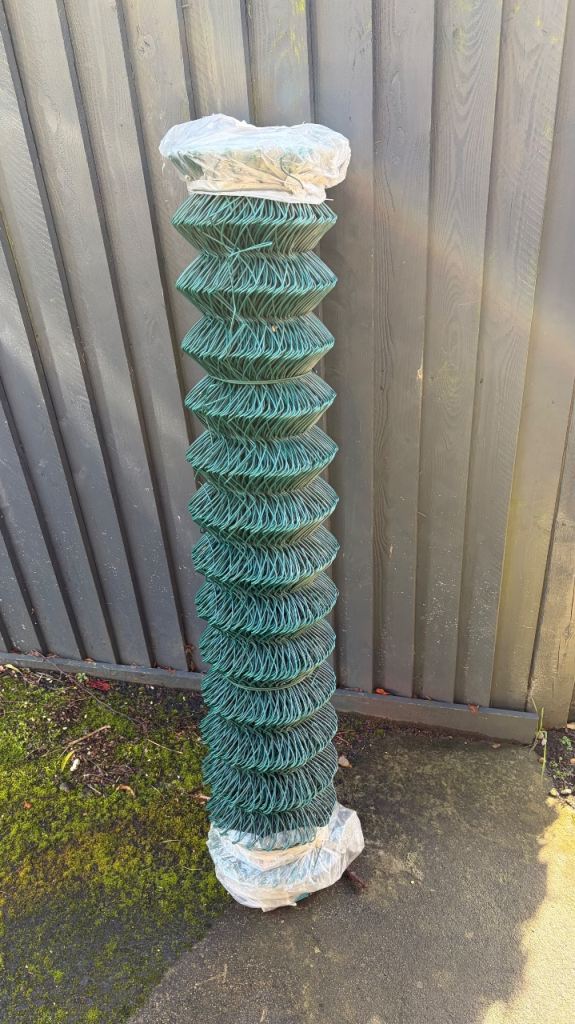 Green plastic coated chain link fencing 25m x 1.2m high