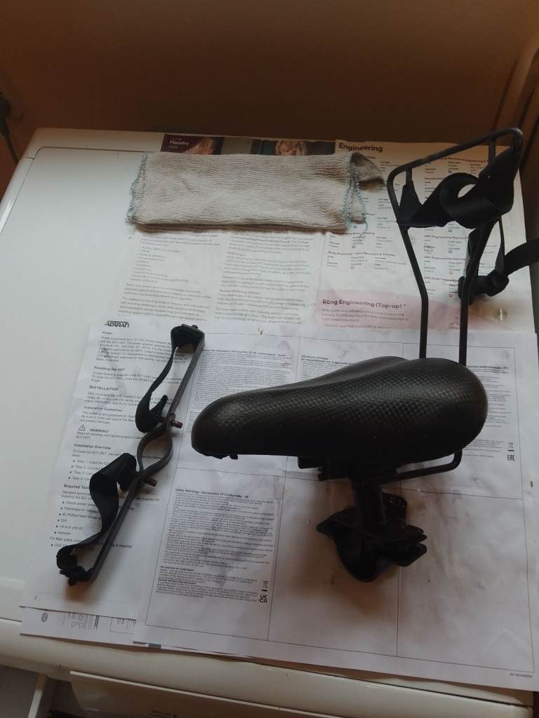 Child's crossbar seat for adult cycle.