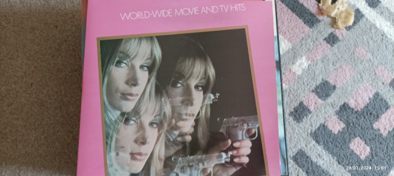 Worldwide Movie and TV Hits 26 different songs Large Vinyl record for  £2 