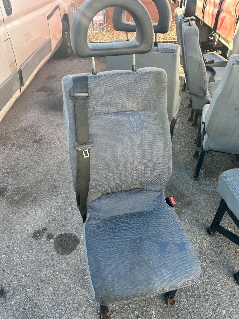 Mini bus seats with built in seatbelts. 