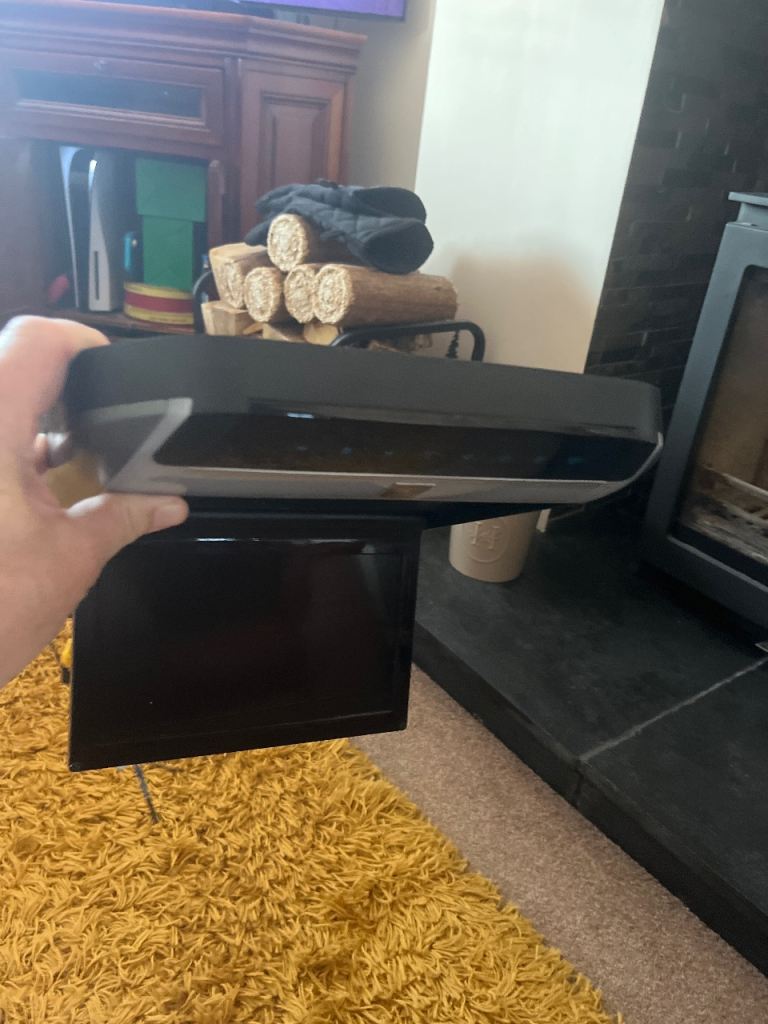Roof mounted drop down DVD player