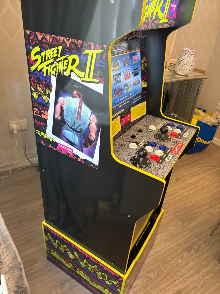 The Street Fighter 2 12-in-1 Capcom Legacy Edition Arcade Machine And stool