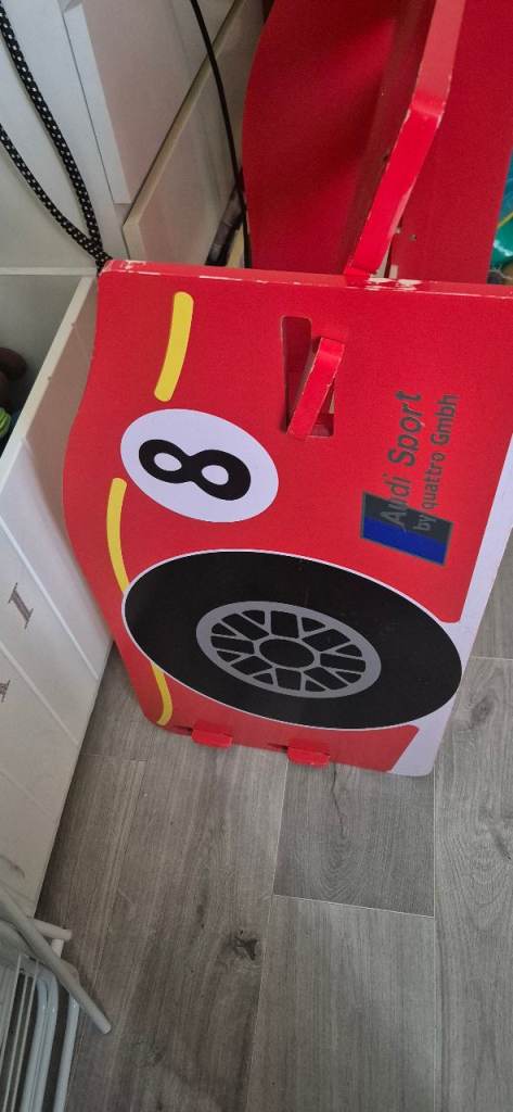 Kids racing car bed red in colour 