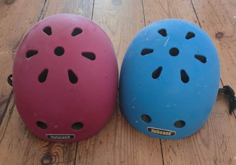 For sale is a pair of Nutcase kids helmets. Blue is size S, and Red one is size M