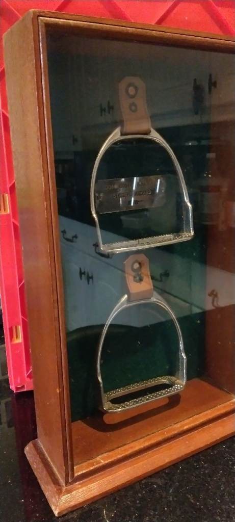 Horse riding stirrups in display case