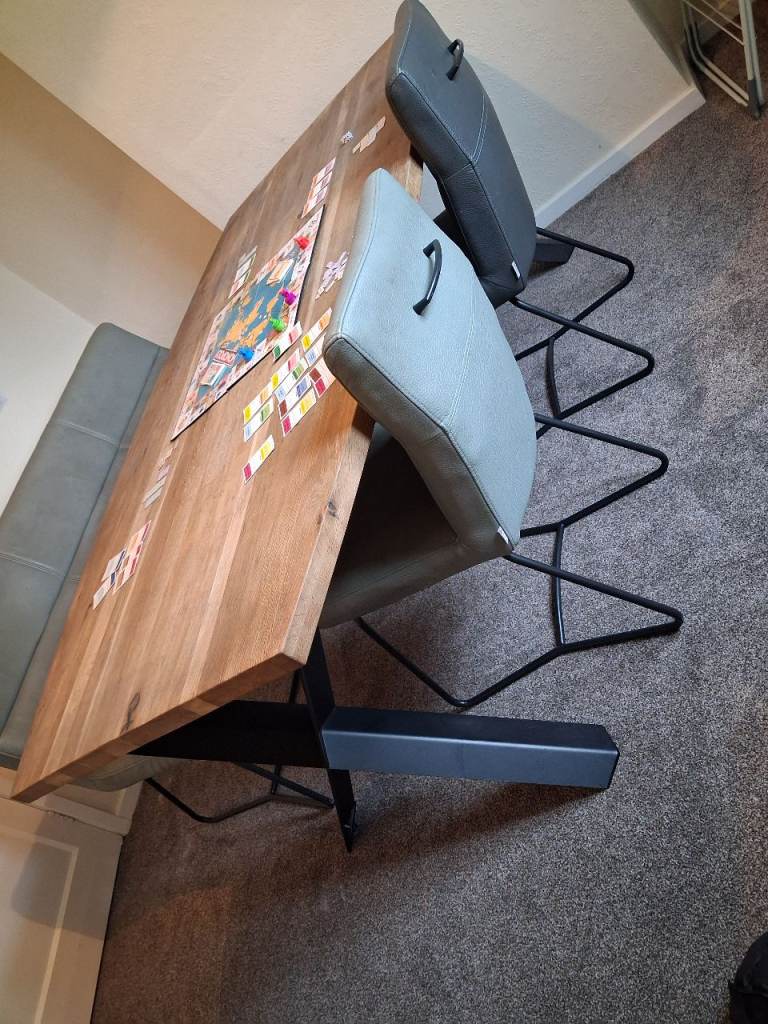 Oak dining table with leather seating 