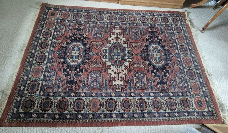 John Lewis rug Axmister woven with traditional Persian Carpet pattern 140cm by 197cm Soumak Kadjar