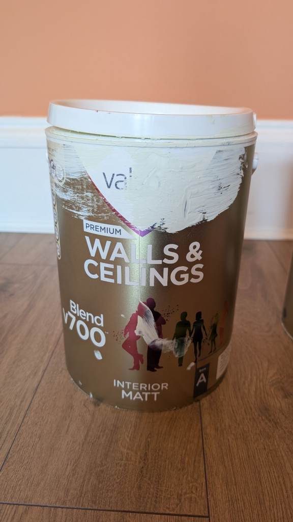 Two opened pots of paint 