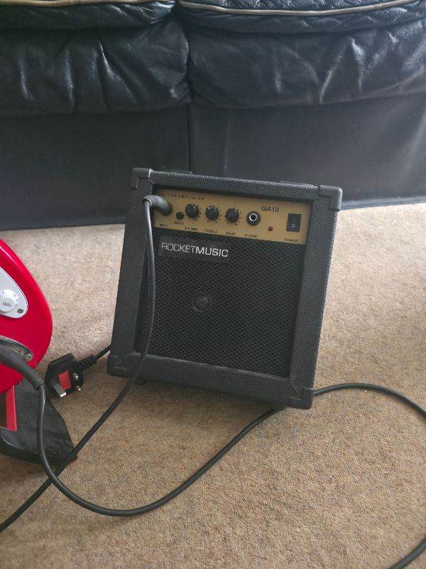 ROCKETMUSIC Red Electric Guitar & Amp – Good Condition