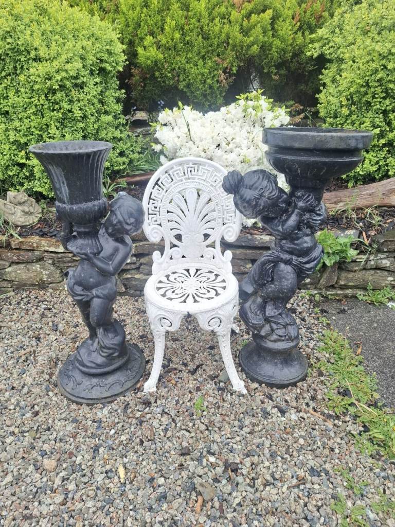 2 large cast iron garden ornaments/urn