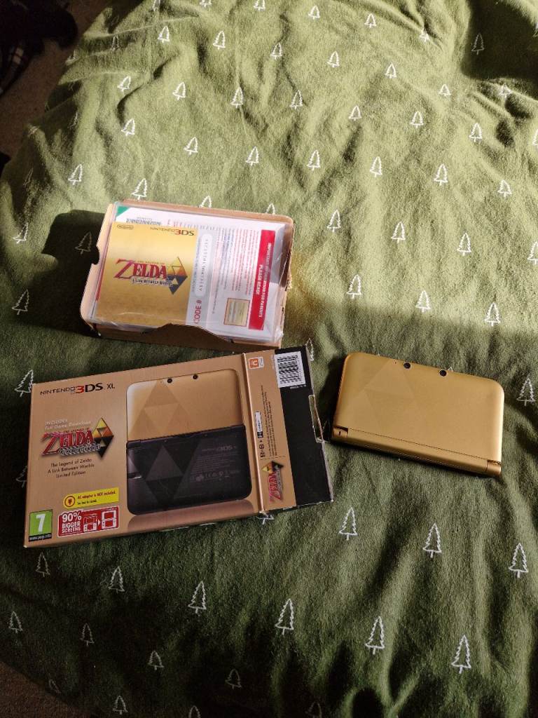Nintendo Zelda 3DS XL console with games