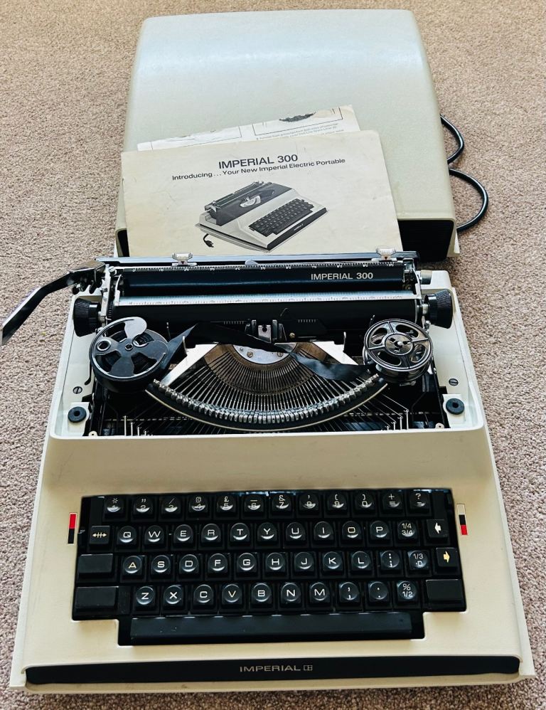 Vintage Imperial 300 electric typewriter in case 