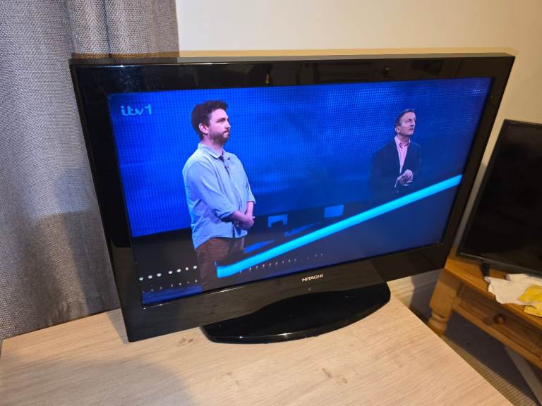 Hitachi 26in LCD TV with stand and remote used..