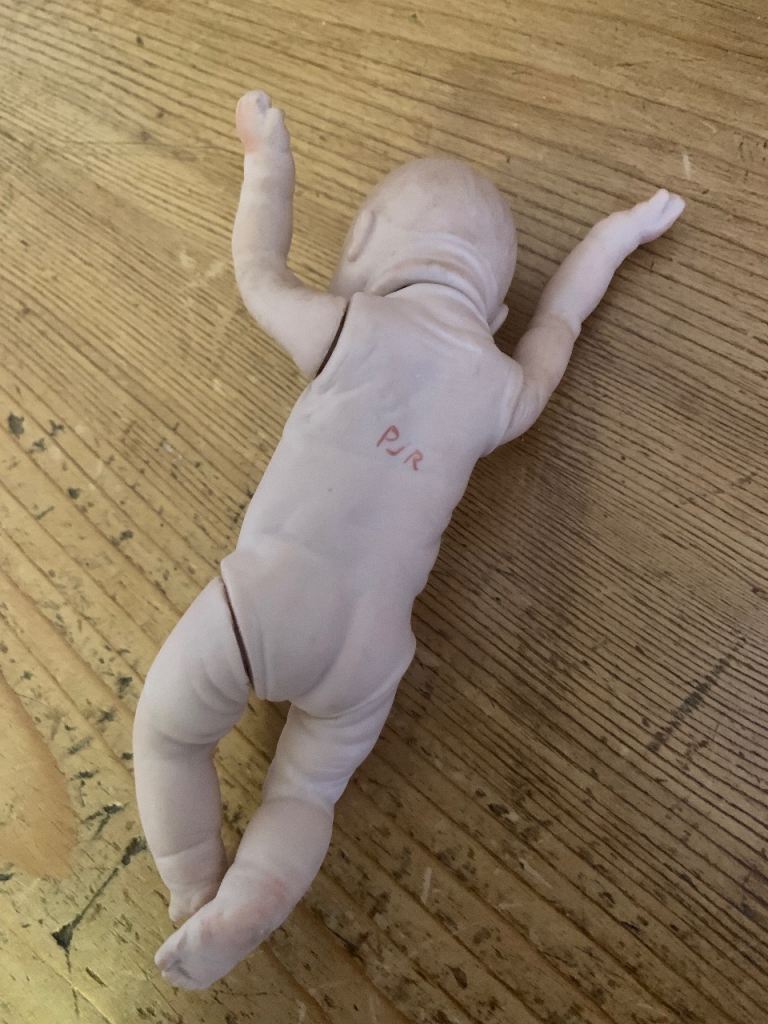 2 vintage dolls, 1 from 1985, 1 eatlier bisque doll