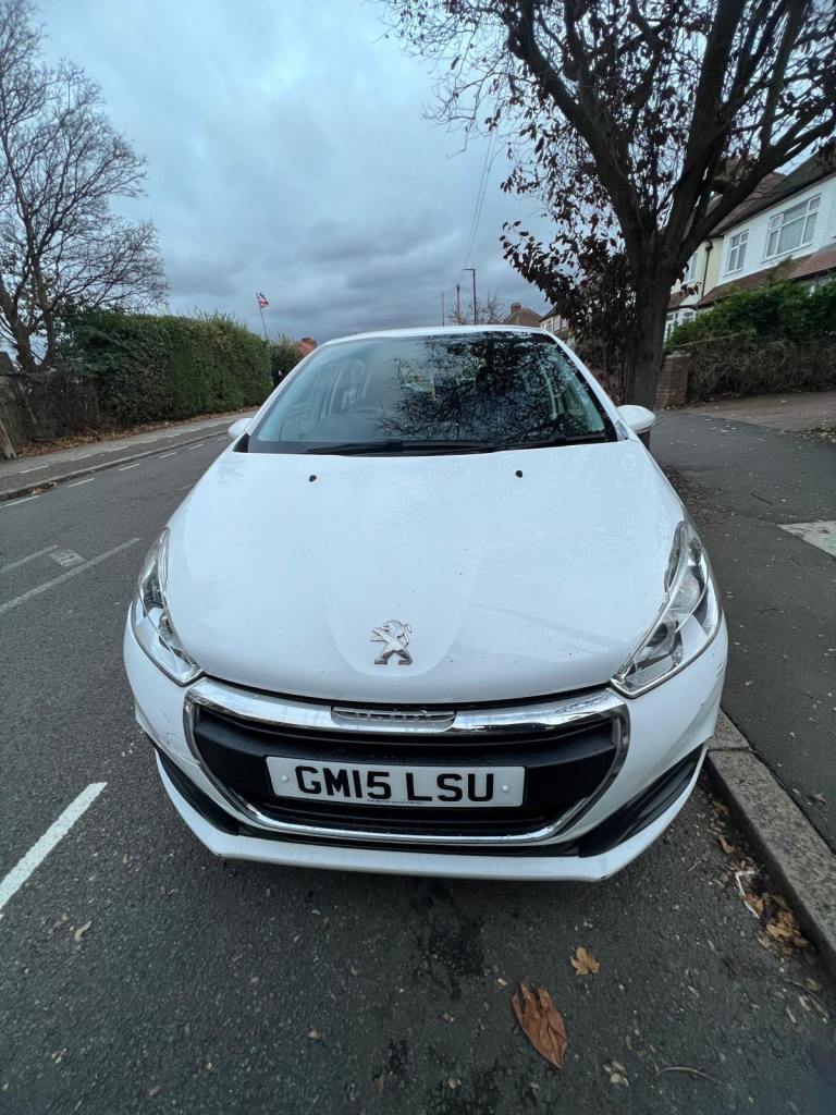 Peugeot 208 white 1200 cc 