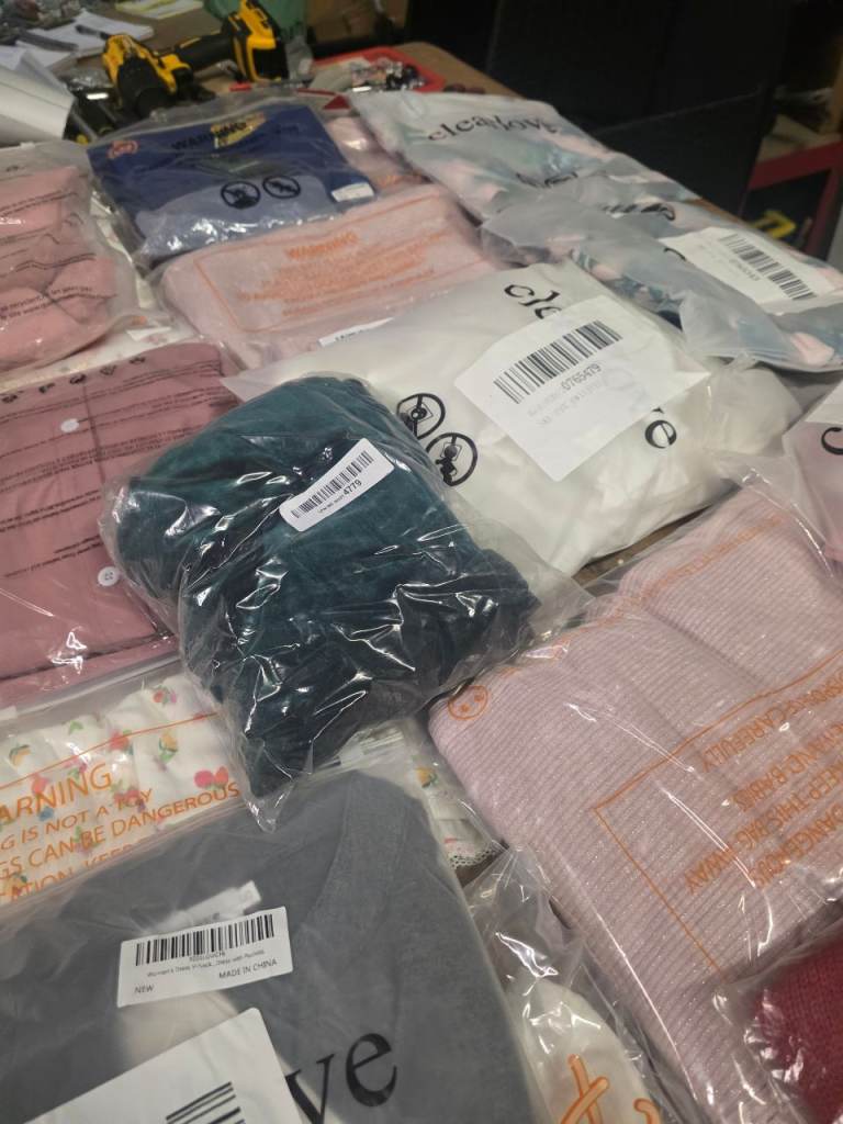 JOB LOTS 50pcs still packed of new mixed clothing 75.00 a bag of 50 eg 