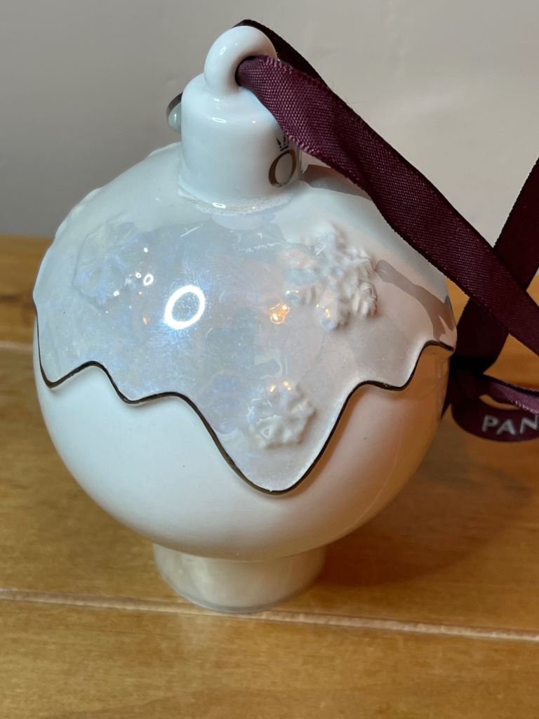 Pandora 2018 Ceramic Christmas pud bauble 2018 with purple ribbon and snowflake detail.