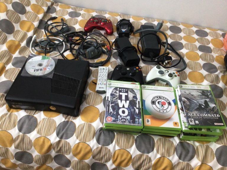 X box 360 S Console plus all cables,power packs,controllers and 21 games 