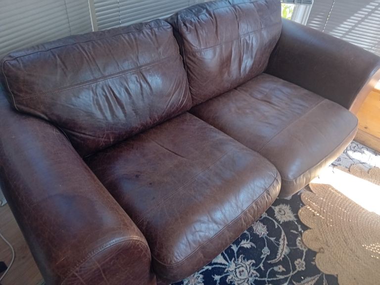 Comfortable Two-Seater Brown Leather Sofa – Good Condition