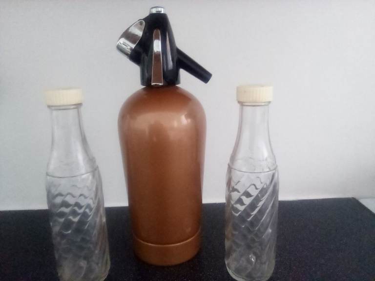 Gold coloured Sparklets Soda Syphon and 2 bottles
