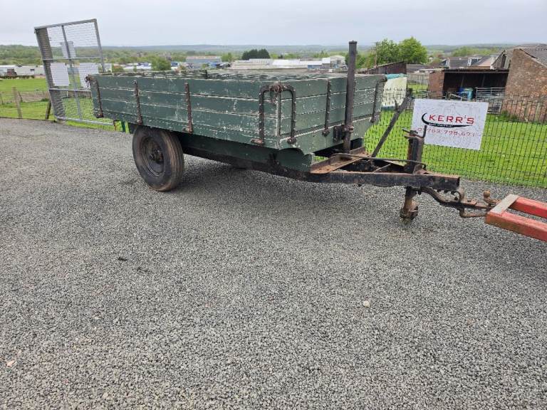 Tractor tipping trailer with drop sides 