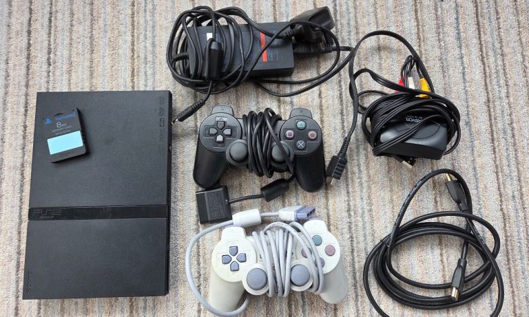 Sony PlayStation 2 Slim Console Bundle with Games and Mics