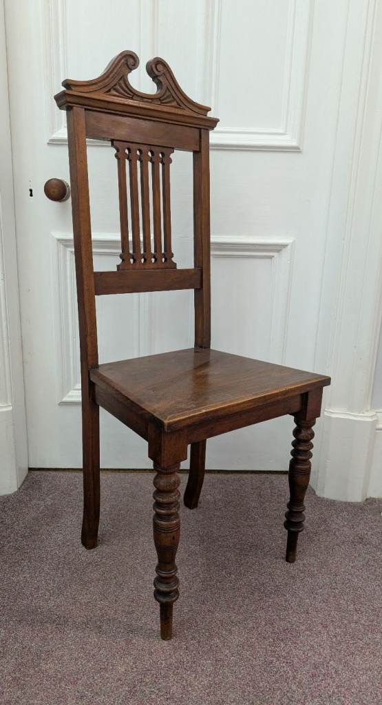Antique Mahogany Chair with carved detail.