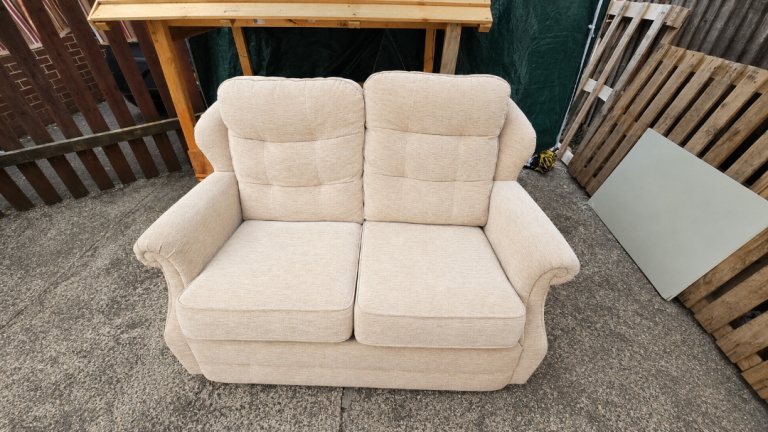 Cosy Two-Seater Sofa – Beige Fabric, Good Condition