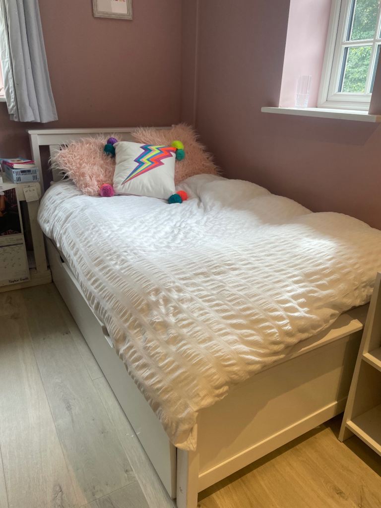 White wooden single bed with trundle and silent night mattress 