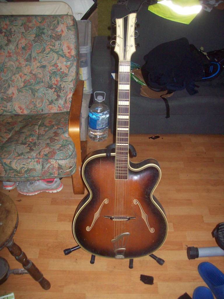 Beautiful arch top (cremona carving) guitar from the 1940’s- 50’s for sale. 