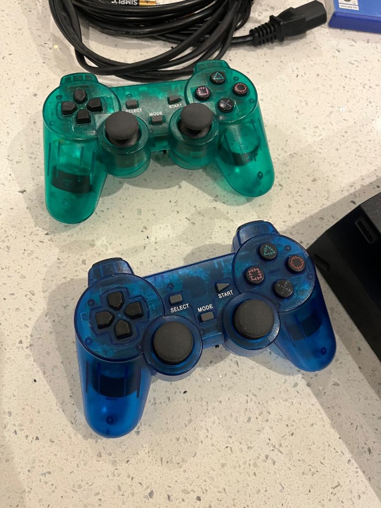 PlayStation 2 with games and microphones 